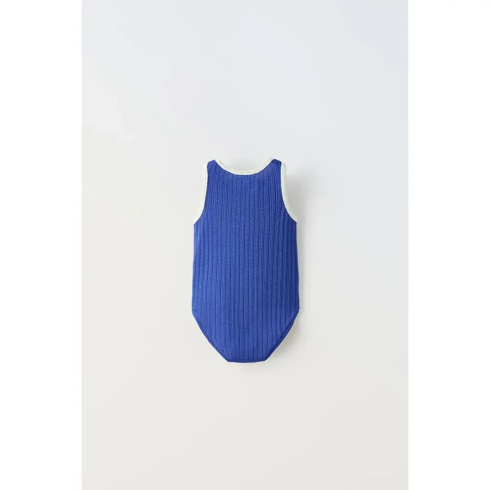 EMBROIDERED PIPED KNIT BODYSUIT